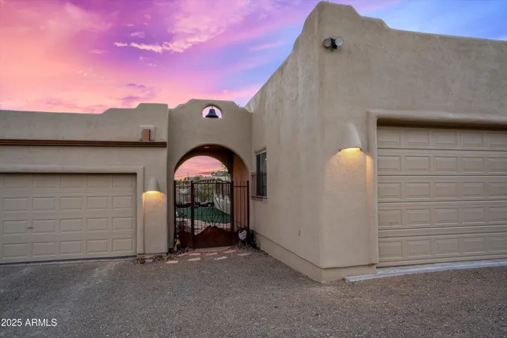 Entrance between attached garage and detached garage/shop