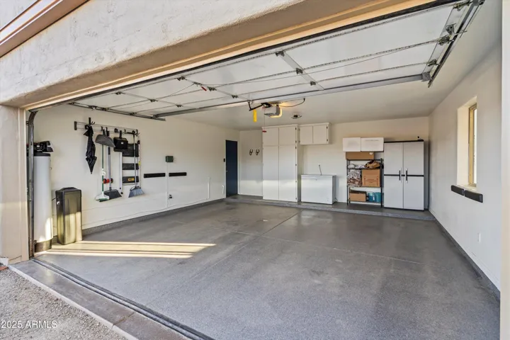 Large attached garage with epoxy flooring
