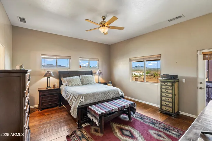 Large primary bedroom with access to the outdoor patio