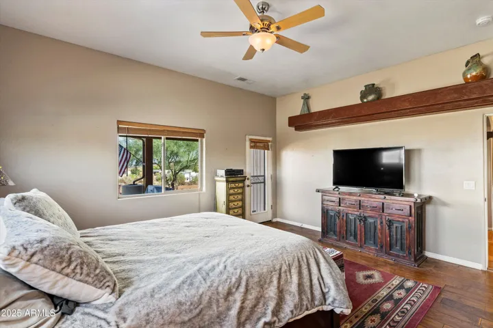 The primary bedroom offer access to the East patio