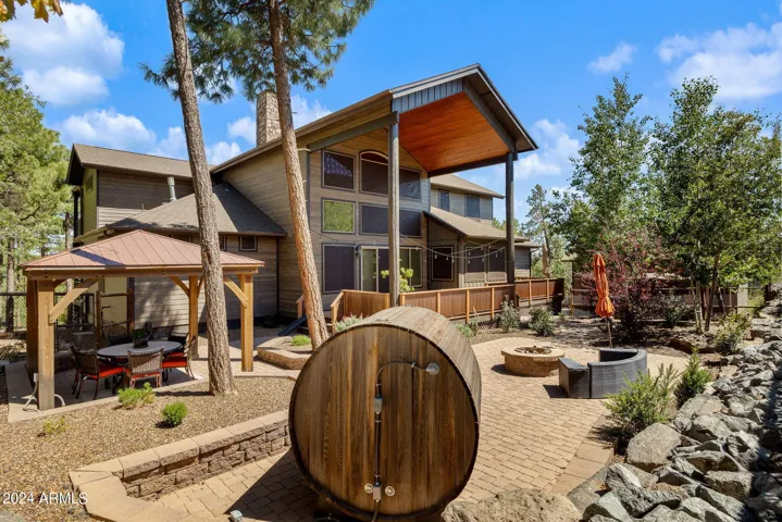 Custom Landscaping throughout the fenced backyard - Perfect for entertaining!