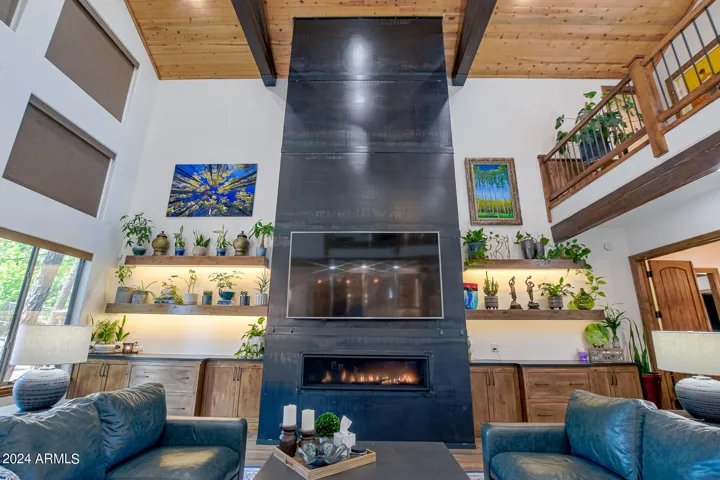 Custom metal fireplace surround with 62" linear gas remote controlled fireplace