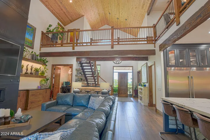 Impressive tongue and groove vaulted ceilings frame the great room