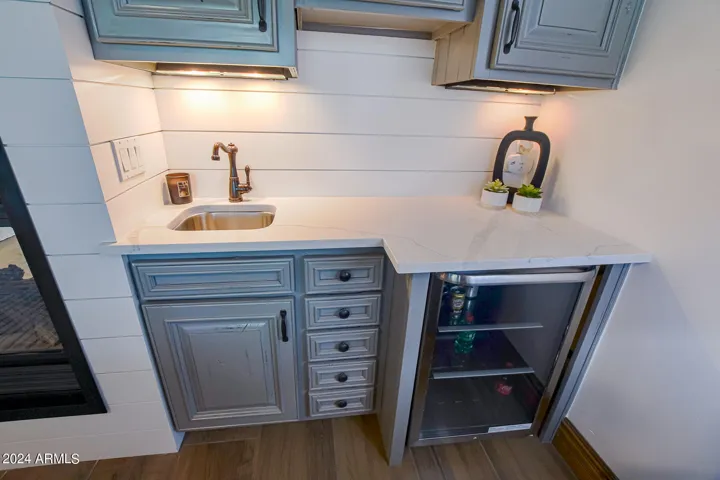 Shiplap surround and custom lighting bring added convenience to the owners suite