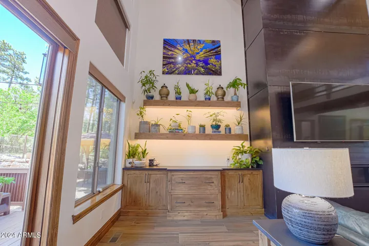 Built in alder cabinetry with large drawers, alder floating shelves with LED lighting