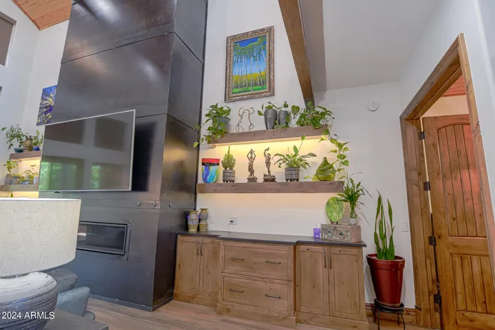 Matching built in alder cabinets and drawers with floating shelfs and LED lighting.