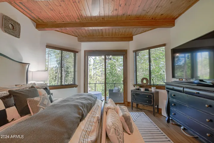 Custom wood and beam ceiling with lots of natural light