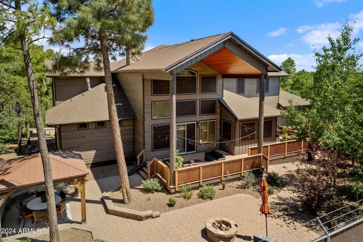 Composite and metal add a touch of warmth surrounding the back deck. The entire home has sun screens