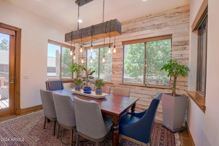 Barnwood wall welcomes you to this comfortable dining room