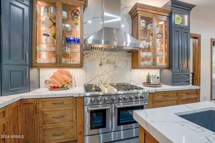 Commercial vent hood with glass front and glass shelves, LED lit cabinets