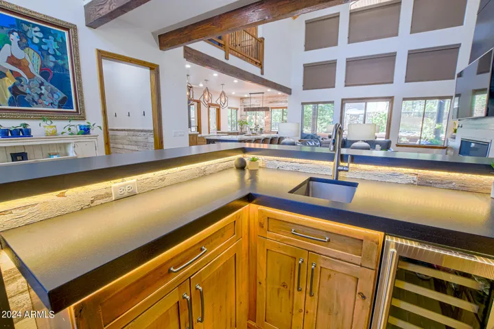 Custom lighting highlights the black leather granite!