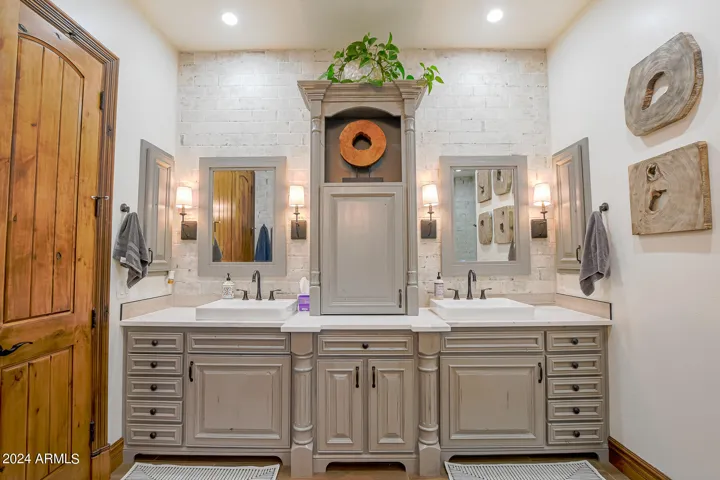 Double sinks, tons of drawers and storage. Full tile backsplash