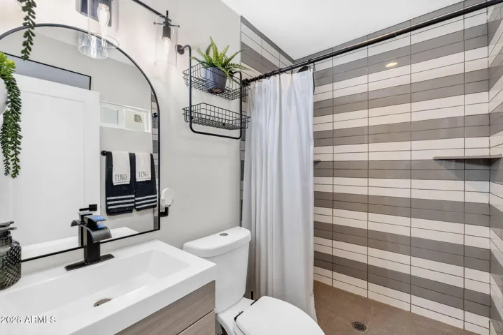 Secondary bathroom with Updated Vanity and Mirror