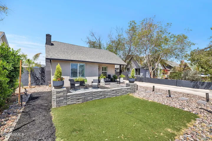 Front Exterior with Lawn and Decorative Patio