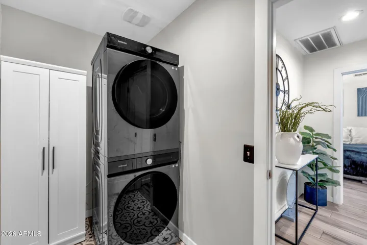 Laundry Area with Stacked Washer and Dryer