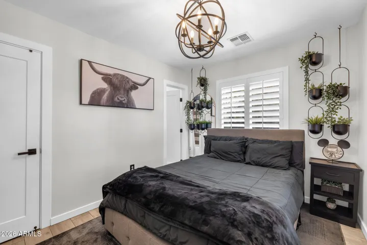 Primary Bedroom with Modern touches and Shutters