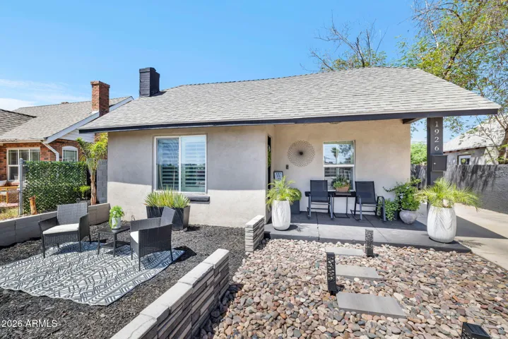 Front Exterior with Patio and Seating Area
