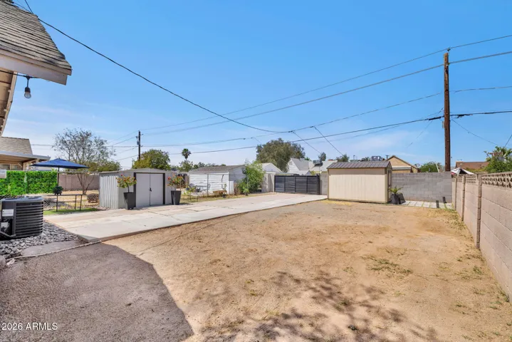 Rear Yard with Rear Lane Access and Parking Area