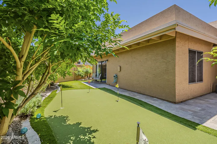 Hone your putting skills in your secluded, beautifully landscaped backyard