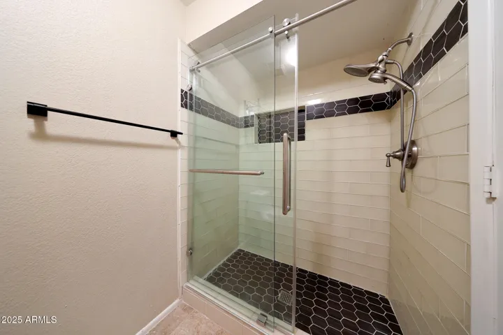 Shower was completely redone from the studs with custom Italian glass tile and Vigo doors