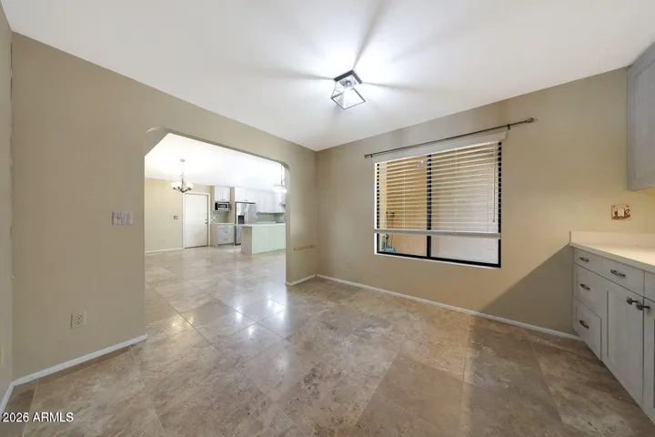Nice-sized den/office/dining area with built-in custom cabinets and quartz countertop