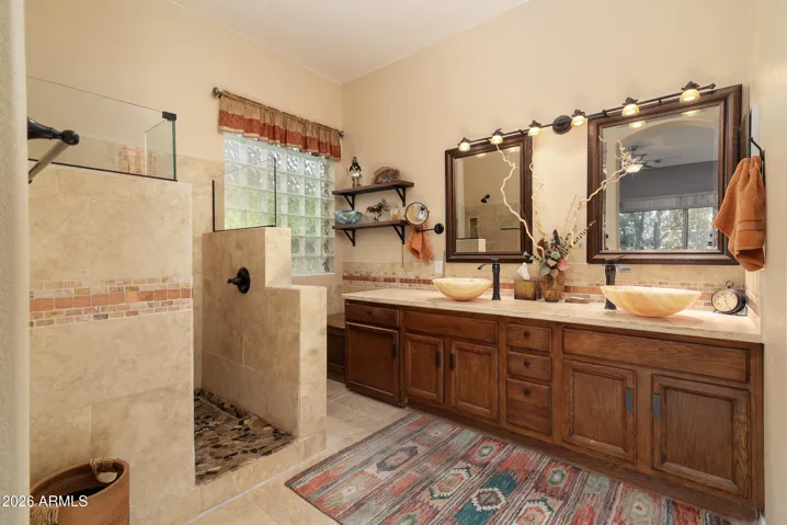 Primary bath with dual sinks, updated walk-in shower