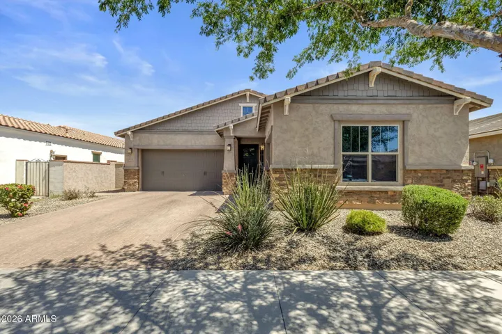 Paver driveway, and 3 car garage.