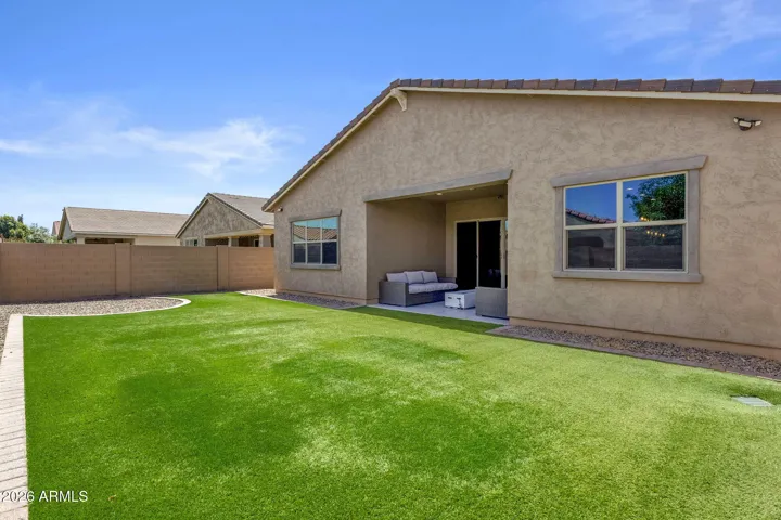 Low maintenance, synthetic turf in back.
