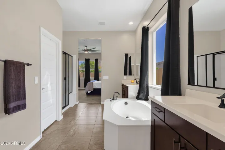 Large primary bathroom with walk-in closet.