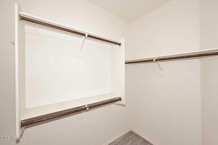 Walk-in closet, primary bedroom