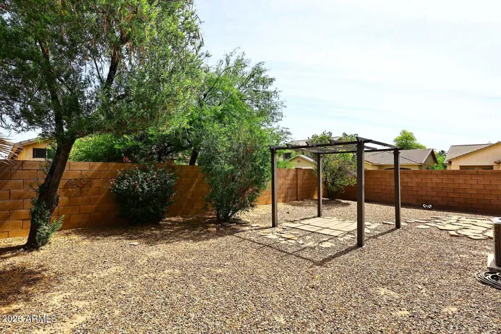 Backyard has pergola