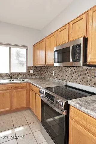 Kitchen electric range and built-in microwave