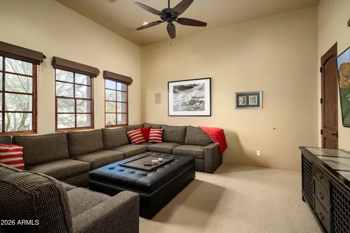 Large Den/Game Room with Custom Sofa and room darkening window treatments