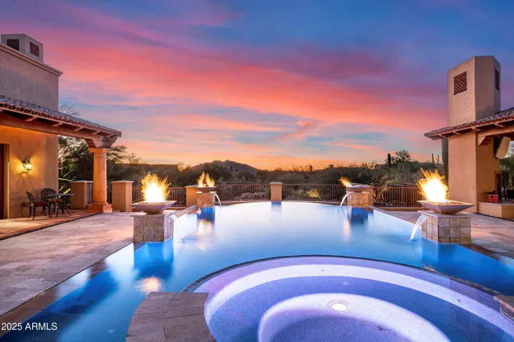 Elevated spa and pool offering gorgeous mountain and sunset views