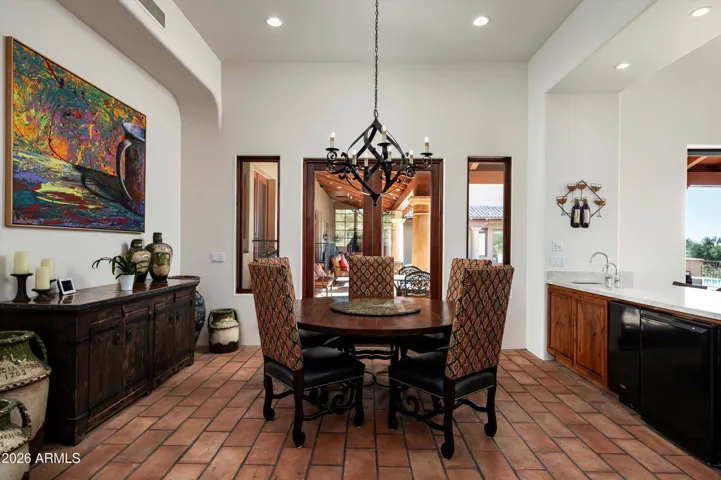 Everyday dining with French doors to patio and adjacent wet bar