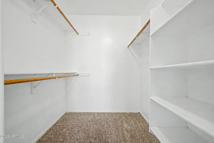 Plenty of storage in primary closet