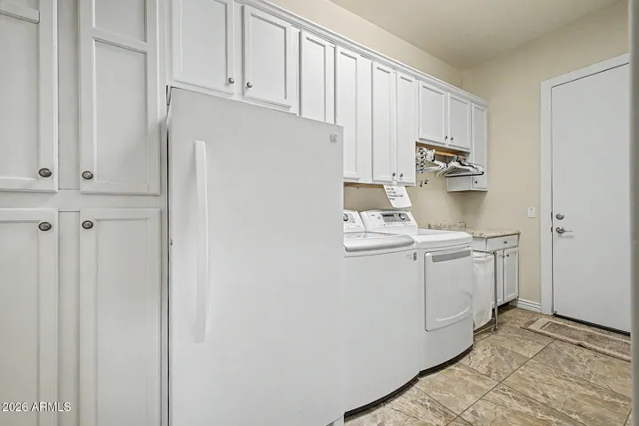 Large laundry with cabinets