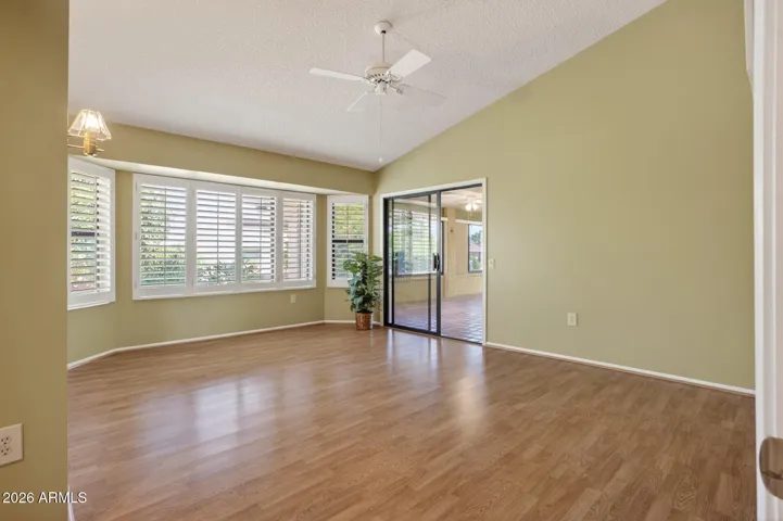 Notice the vaulted ceiling, bay window and slider out to the AZ room.