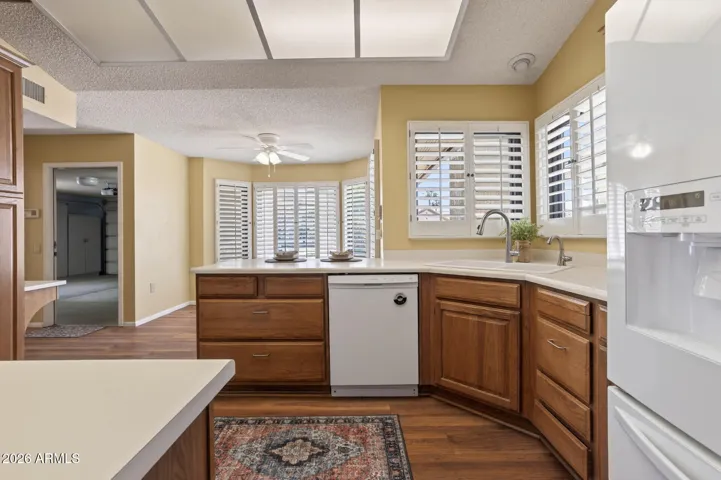 The kitchen opens up into the breakfast nook with views of the front yard.