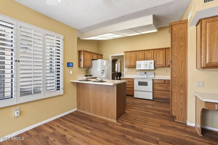 The breakfast bar offers a spot for stools and a casual meal.