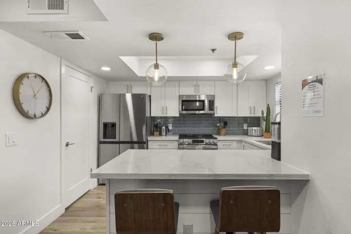 Door on the left is washer and dryer