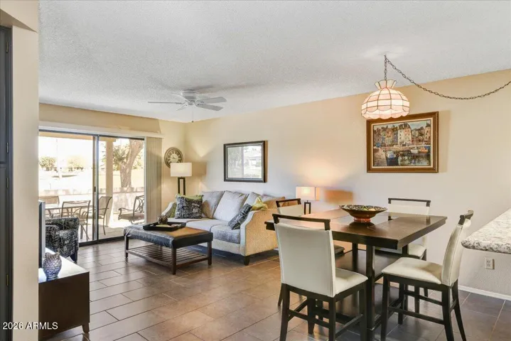 Open concept floorplan with tile flooring and large slider provides lots of natural light