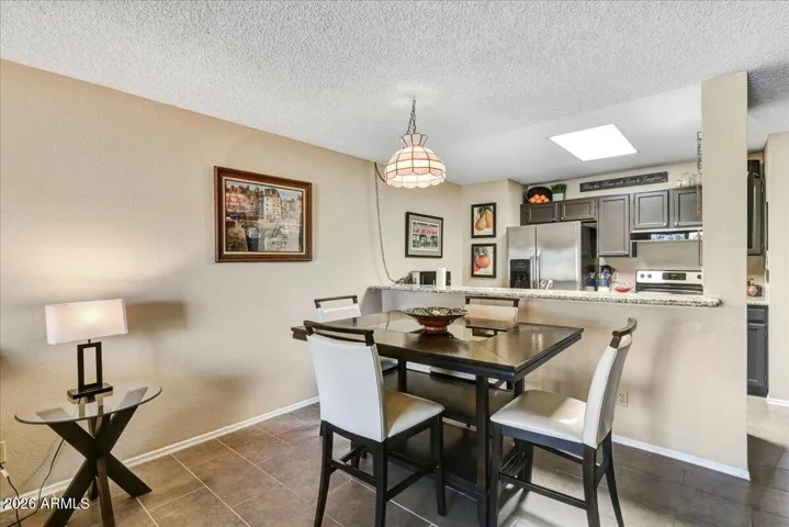 Dining room off of kitchen with bar