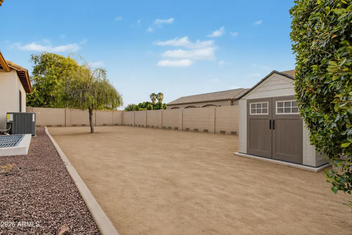Irrigated acre lot with mature landscaping