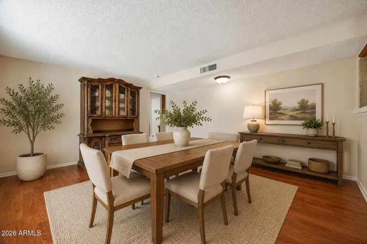 Virtually staged dining/ living room.