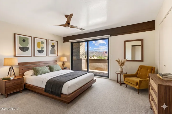 Spacious Primary Suite with its private view deck and high quality Anderson Windows. [photo with virtually staged furnishings]