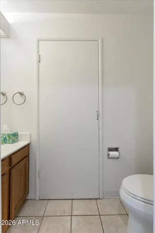 Downstairs half-bath Powder Room with access to additional storage and fairly new 40-gal water heater.