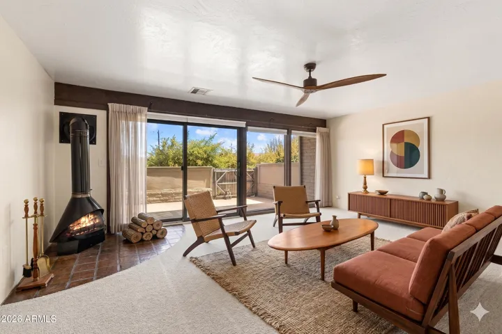 Relax with friends and family in the pleasant Living Room , full of natural light from the home's 1st floor patio. [photo with virtually staged furnishings]