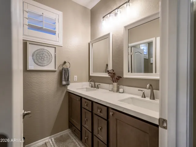Updated cabinets and countertops in secondary hall bath