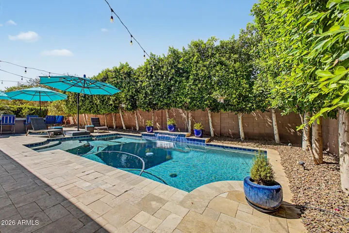 Solar heated pool with privacy from neighbors